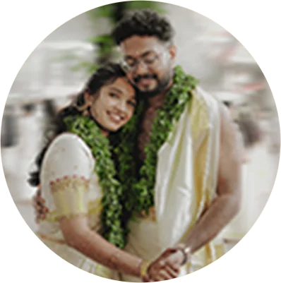Wedding couple wearing floral garlands