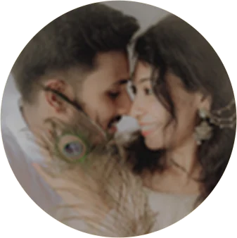 Couple together with a peacock feather